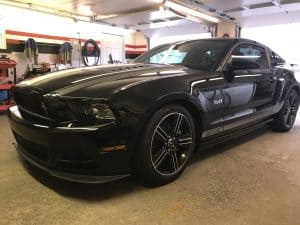 black sports car in garage