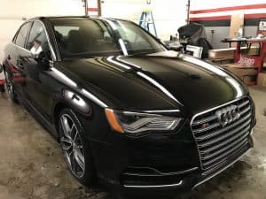 black audi that was detailed in a garage